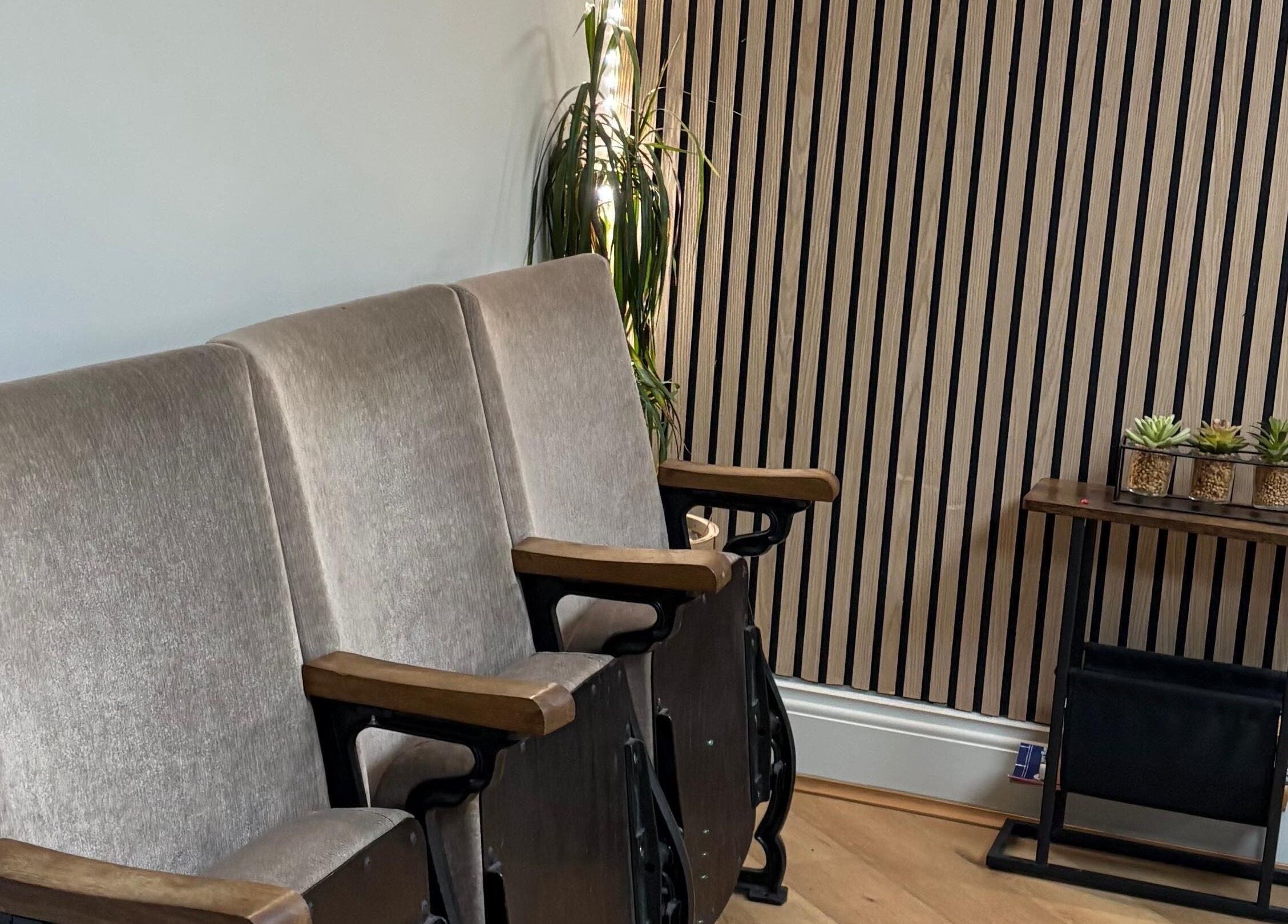 Plush seating at Coa Hair in York, England, GB, with a stylish modern decor enhancing relaxation.