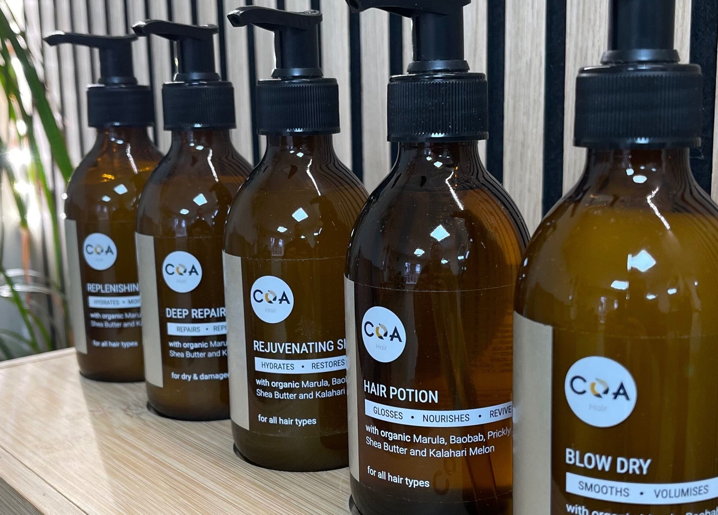 Coa Hair product lineup in York, England, GB: a range of nourishing hair care bottles displayed.