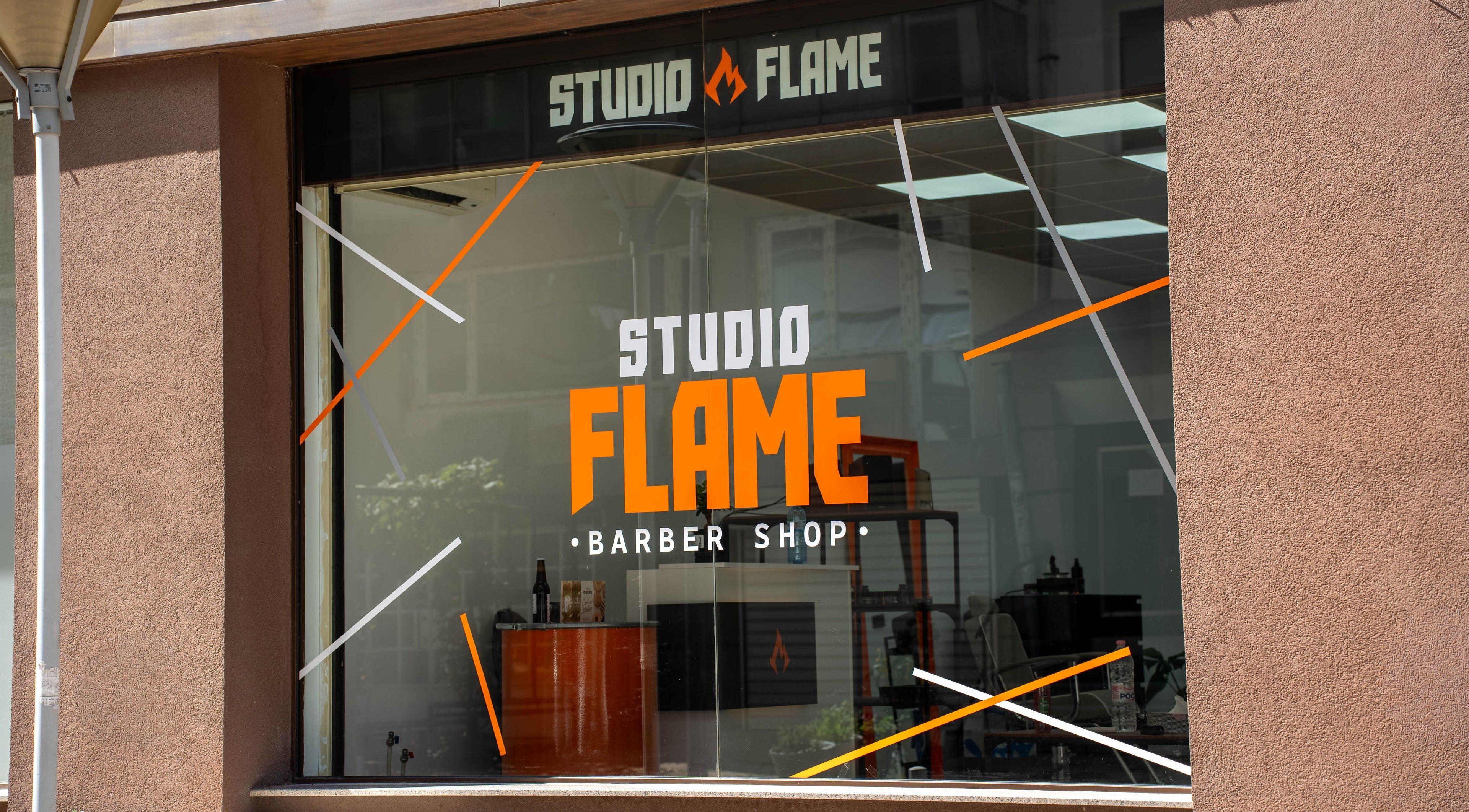 Фасада на Studio Flame в София, Софийска област, BG с модерен дизайн и ярко лого.