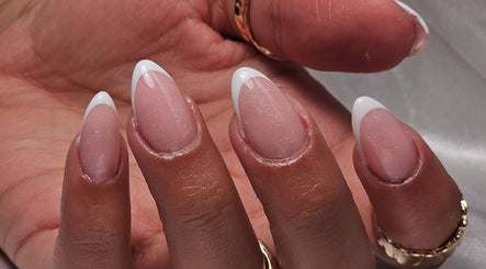 Elegant French manicure at The Glow Way - TGW, Bedford, England, GB, showcasing glossy finish.