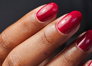 Close-up of glossy red nails at The Glow Way - TGW, Bedford, England, GB, showcasing exquisite nail art.