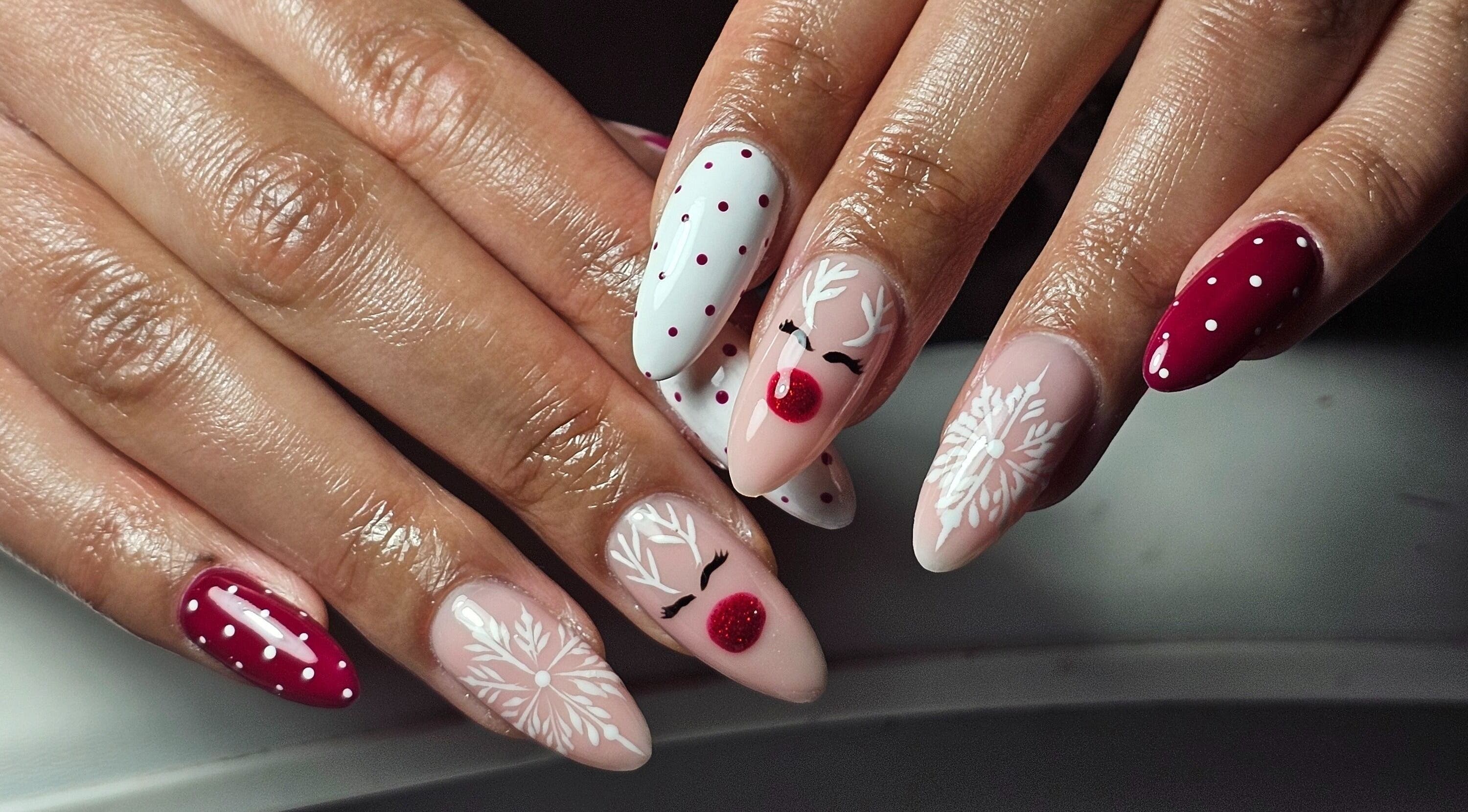 Elegant reindeer nail art at The Glow Way - TGW in Bedford, England, GB.