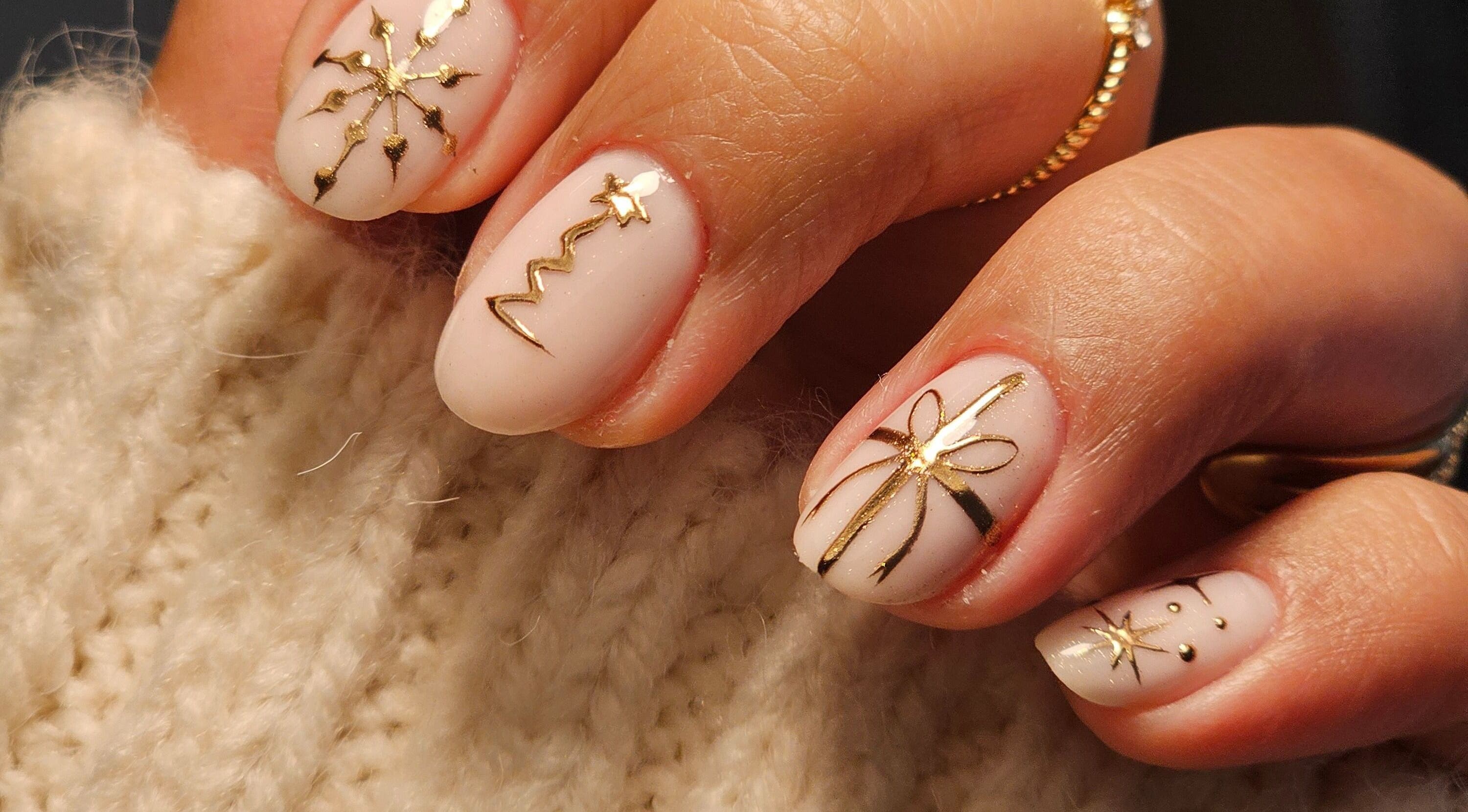 Elegant gold nail art by The Glow Way - TGW, Bedford, England, GB showcasing intricate designs.