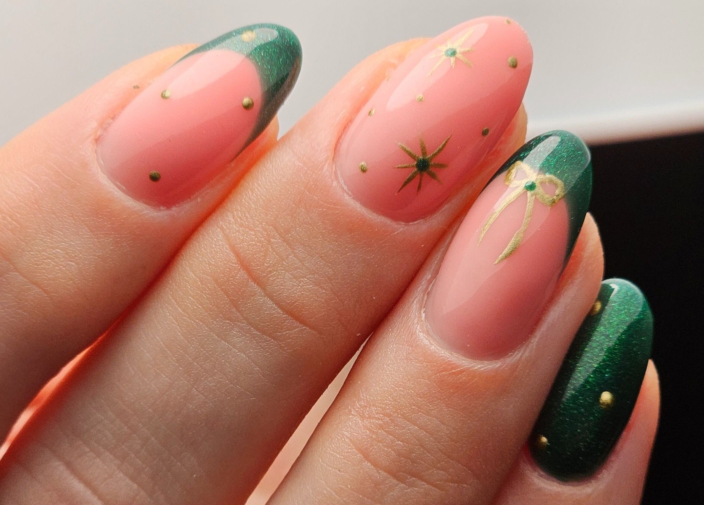 Elegant nail art with green and gold design at The Glow Way - TGW, Bedford, England, GB.