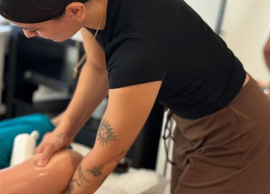 Therapist at BL | Massage Therapist giving a leg massage in London, England, GB.