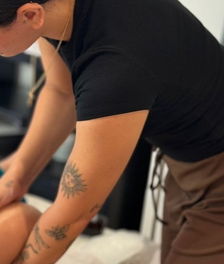 Therapist at BL | Massage Therapist giving a leg massage in London, England, GB.