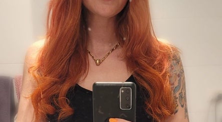 Vibrant ginger hair styled in waves at Hair Beauty Studio - Slavic Hair Extensions, Melbourne, Victoria, AU.