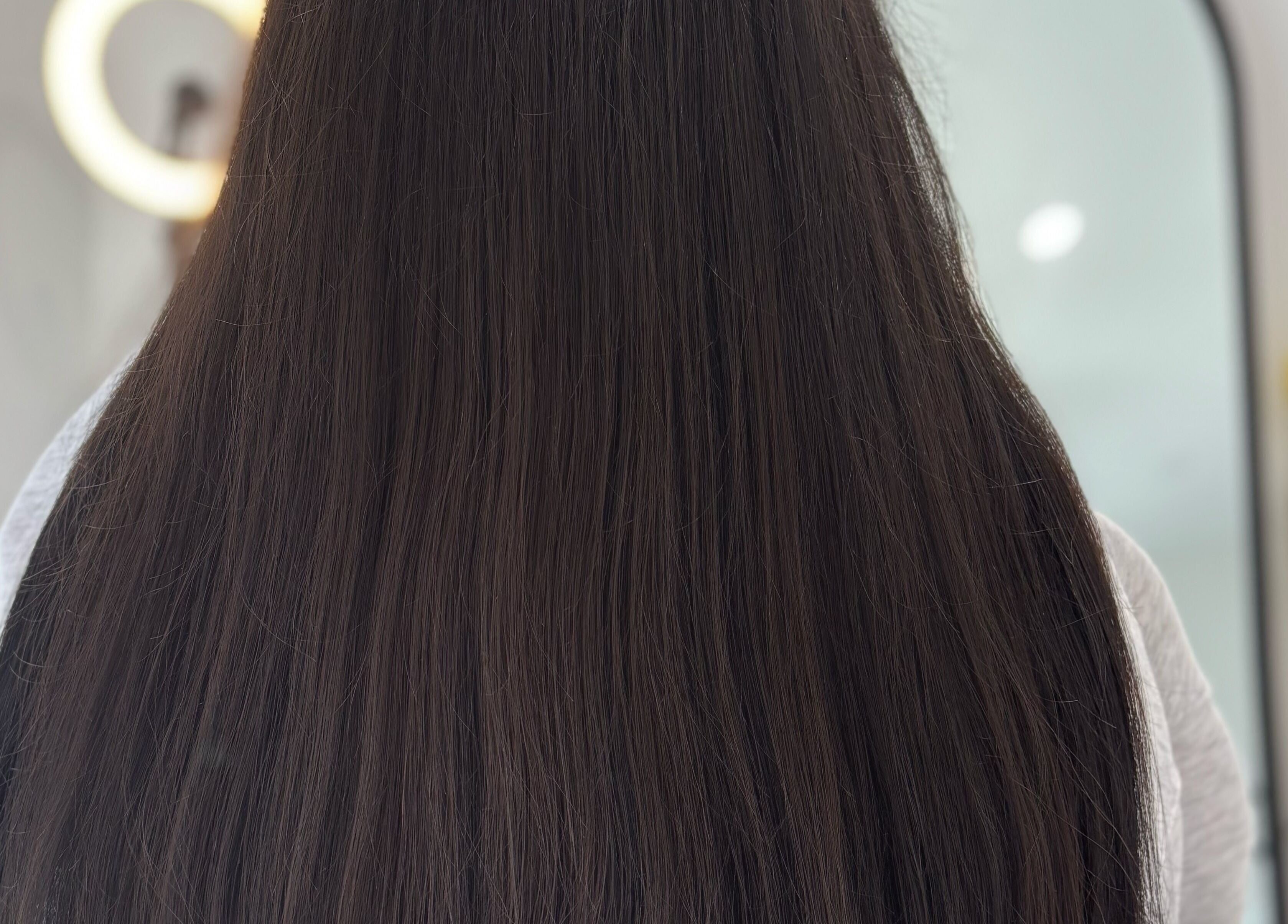 Long, sleek hair styled at Hair Beauty Studio - Slavic Hair Extensions, Melbourne, Victoria, AU.