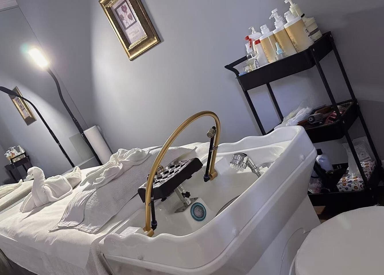Relaxing treatment room at Unik Spa, Nyack, New York, US with plush towels and ambient lighting.