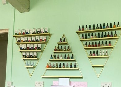 Geometric shelves with nail polish at Ritual Nail Spa, Hebden Bridge, England, GB for vibrant nail care.