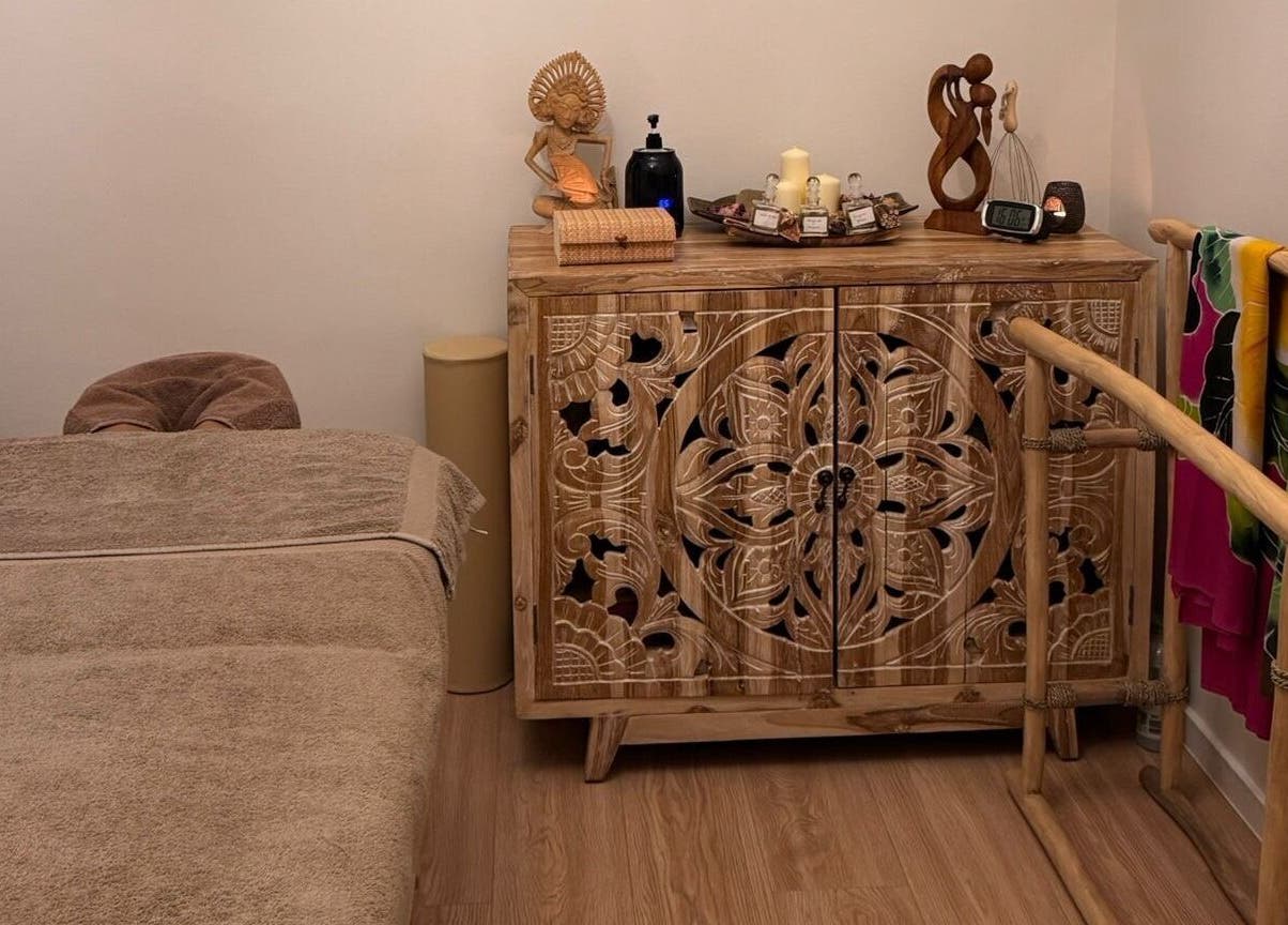 Tranquil massage room with carved wooden decor at Taksu SPA, București, București, RO.