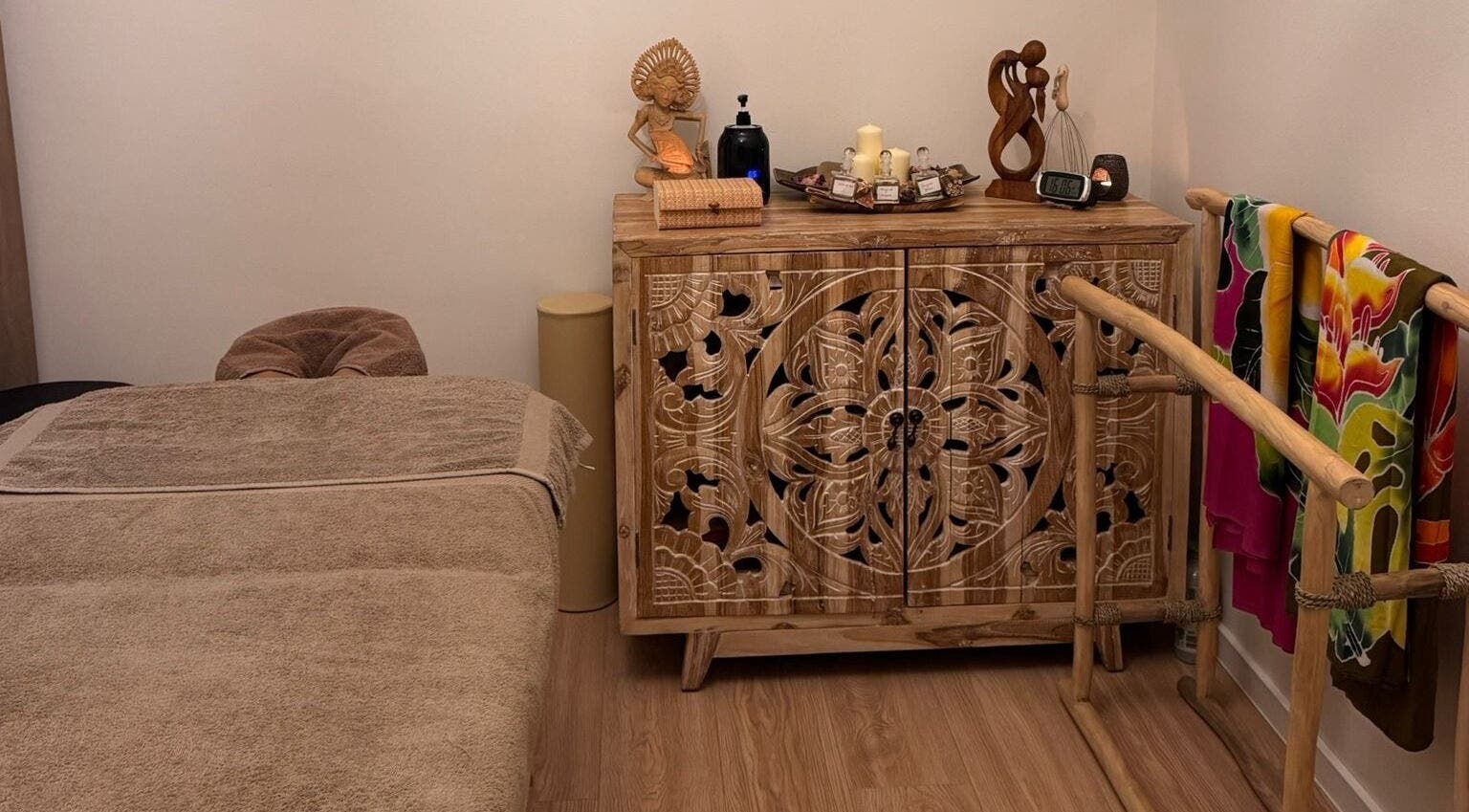 Tranquil massage room with carved wooden decor at Taksu SPA, București, București, RO.