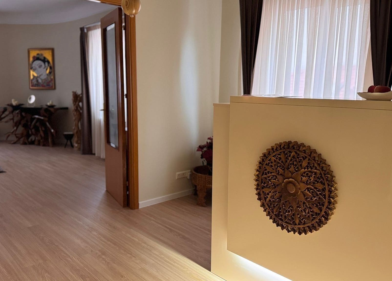 Elegant interior of Taksu SPA in București featuring artful decor and warm lighting.