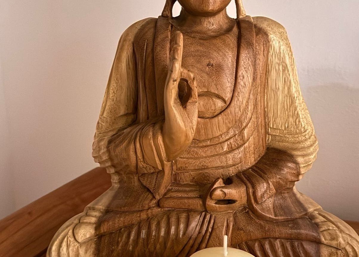 Wooden Buddha statue creates a serene atmosphere at Taksu SPA in București, București, RO.