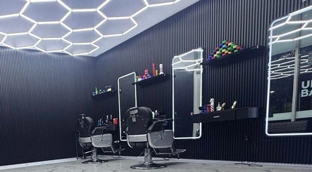 Modern interior of Unique Barbershop Hamilton New Zealand in Hamilton, Waikato Region, NZ with barber chairs.