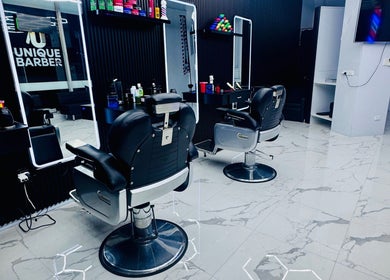 Modern interior of Unique Barbershop Hamilton New Zealand featuring sleek barber chairs in Hamilton, Waikato Region, NZ.