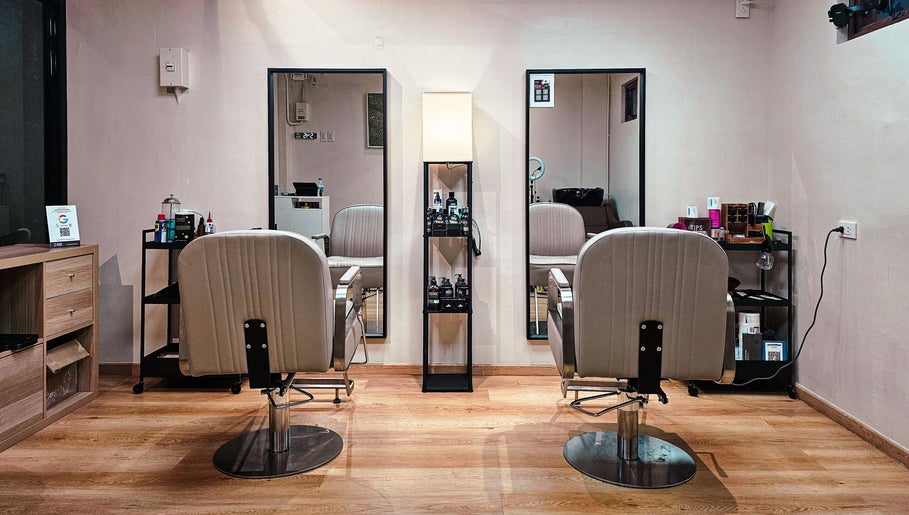 Modern salon setup at Manong Barbers UP Diliman, QC in Quezon City, Metro Manila, PH with sleek chairs and mirrors.
