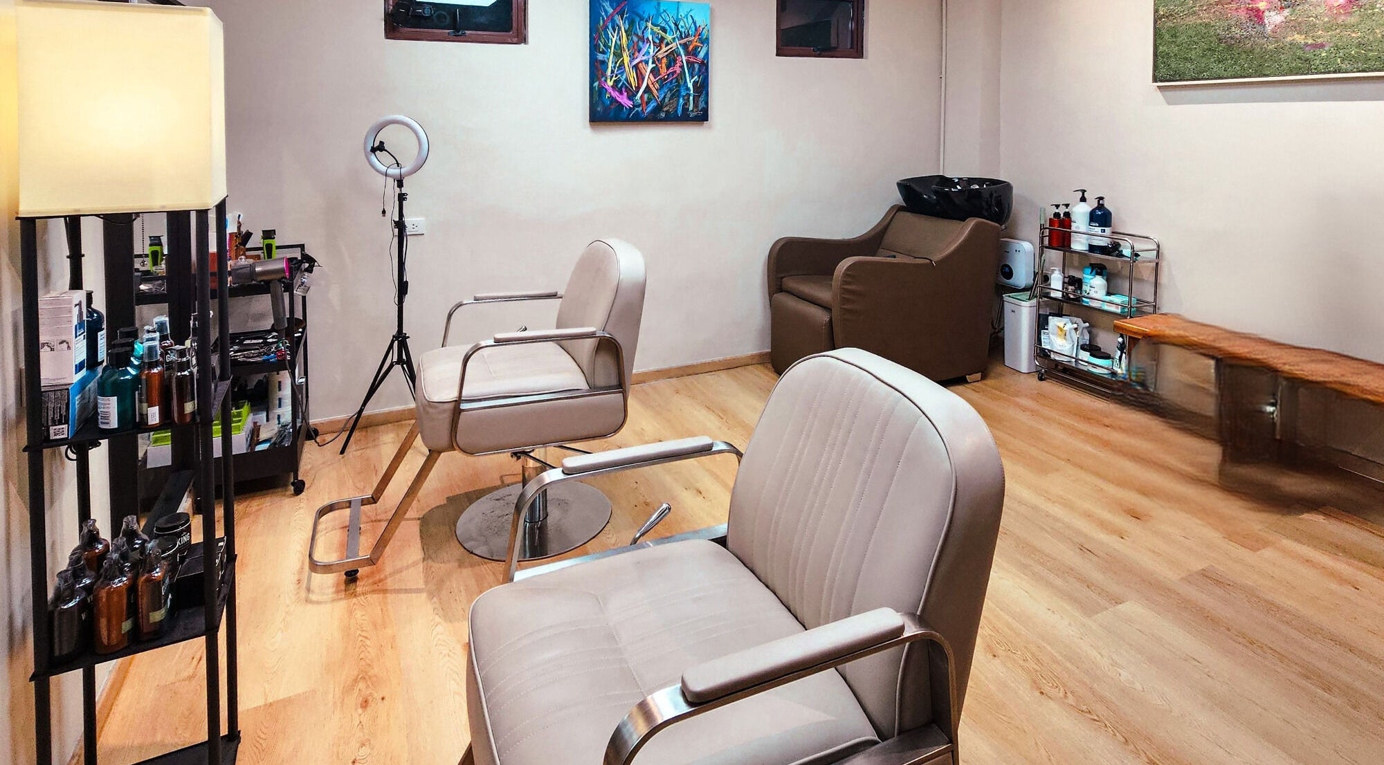 Stylish interior at Manong Barbers Studio - UP Diliman, QC in Quezon City, Metro Manila, PH with modern chairs.
