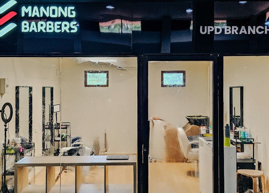 Front view of Manong Barbers Studio - UP Diliman, QC in Quezon City, Metro Manila, PH showcasing a modern aesthetic.