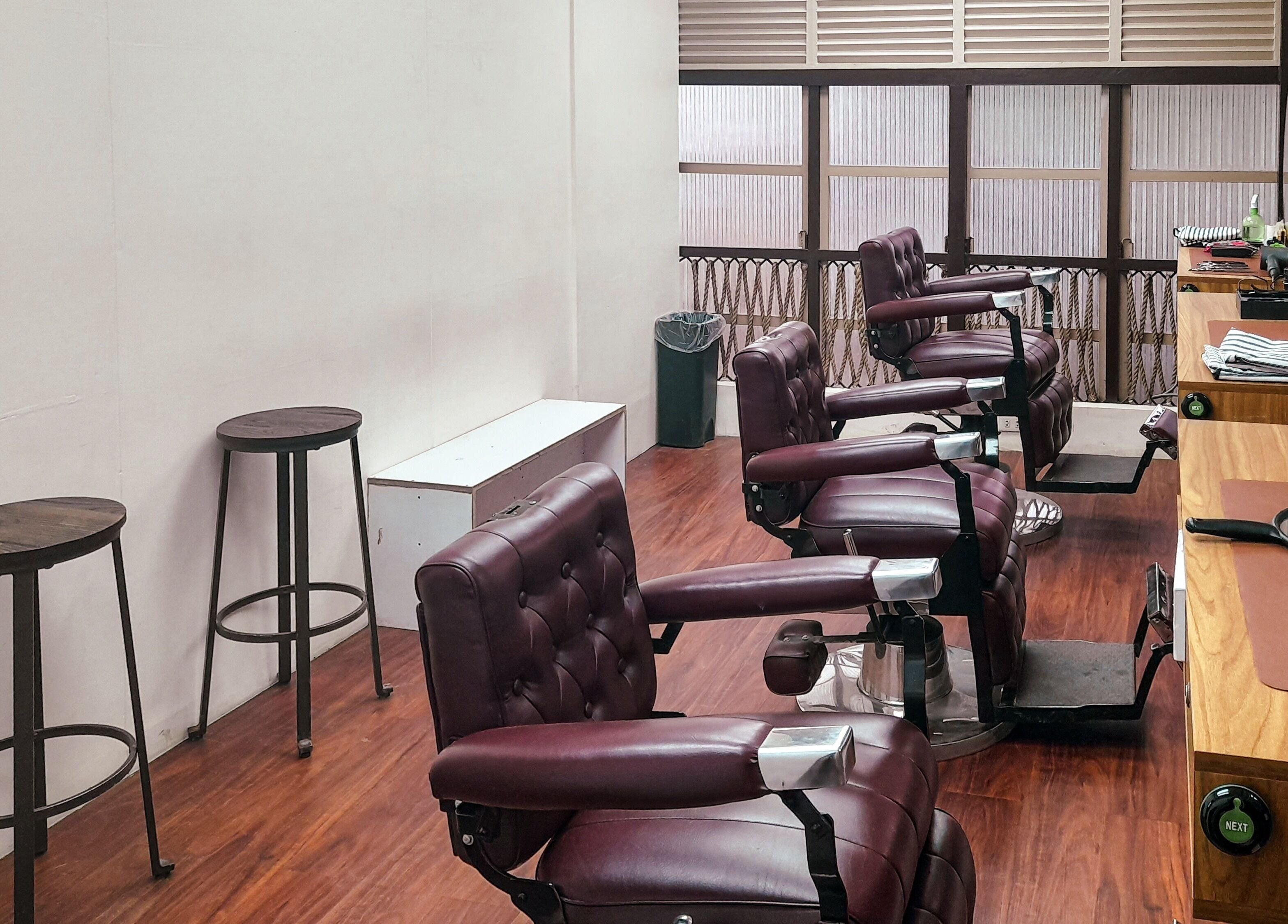 Chic barber chairs at Manong Barbers - Angono, Rizal, Angono, Calabarzon, PH, offering stylish grooming.