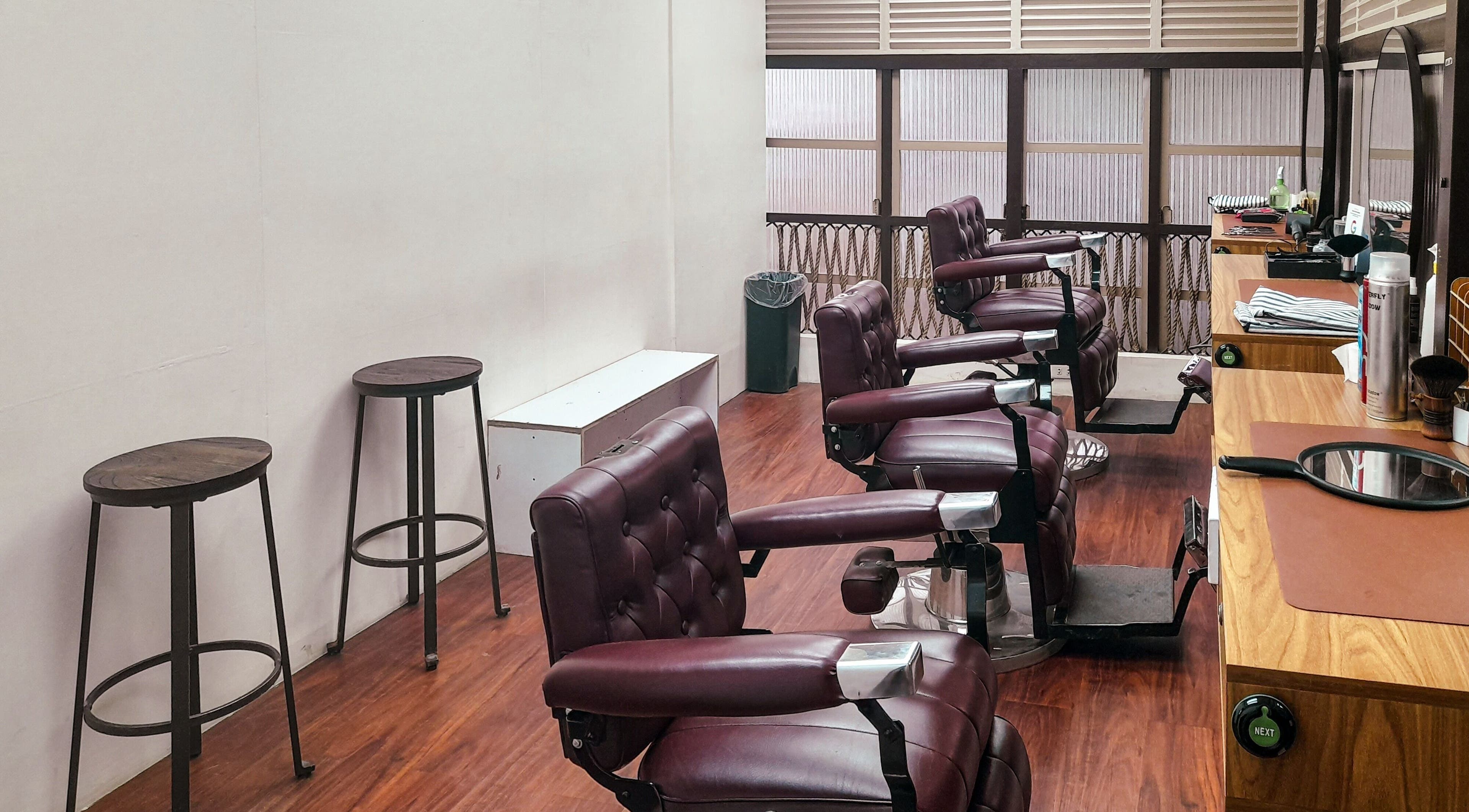 Chic barber chairs at Manong Barbers - Angono, Rizal, Angono, Calabarzon, PH, offering stylish grooming.