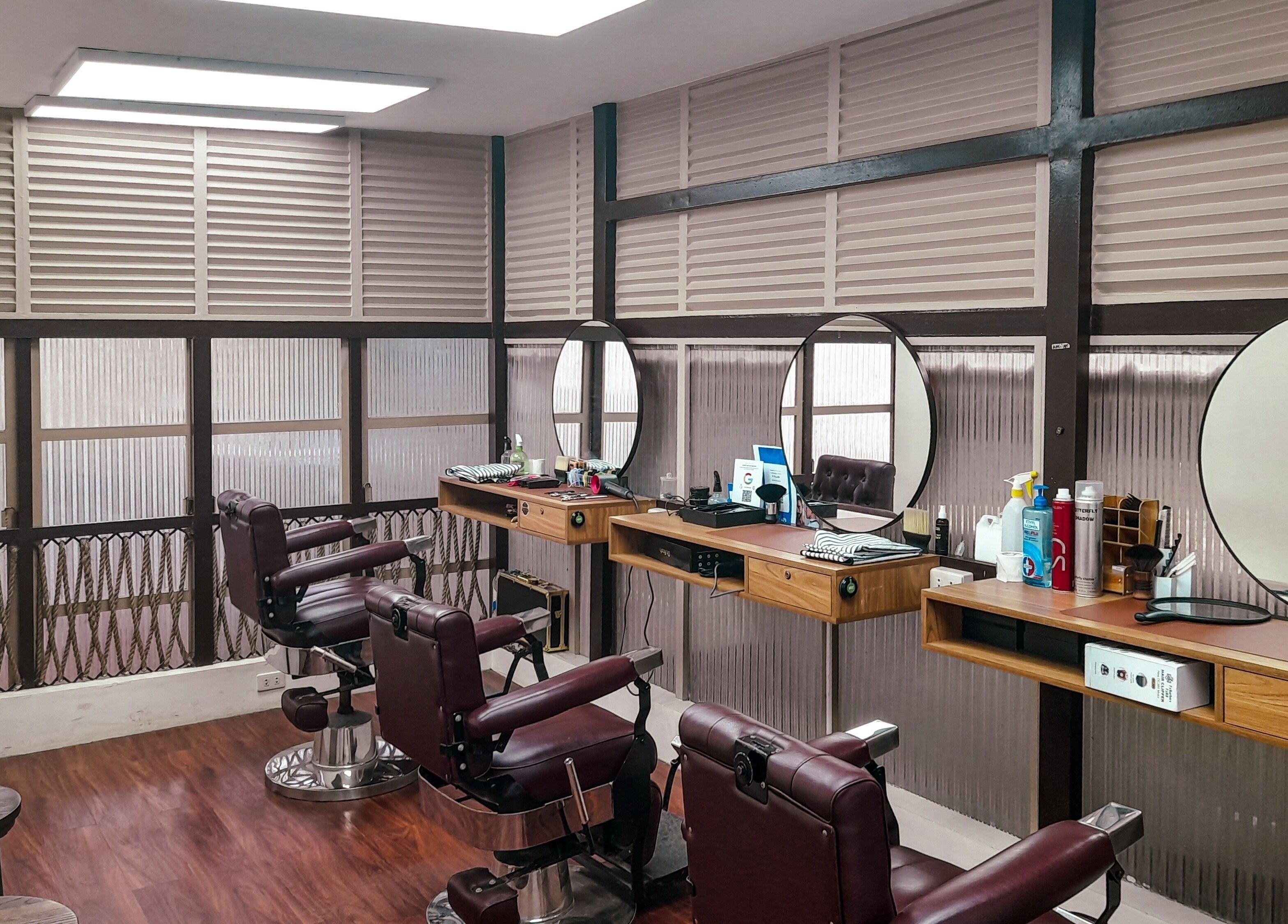 Elegant interior of Manong Barbers - Angono, Rizal in Angono, Calabarzon, PH showcasing vintage barber chairs.