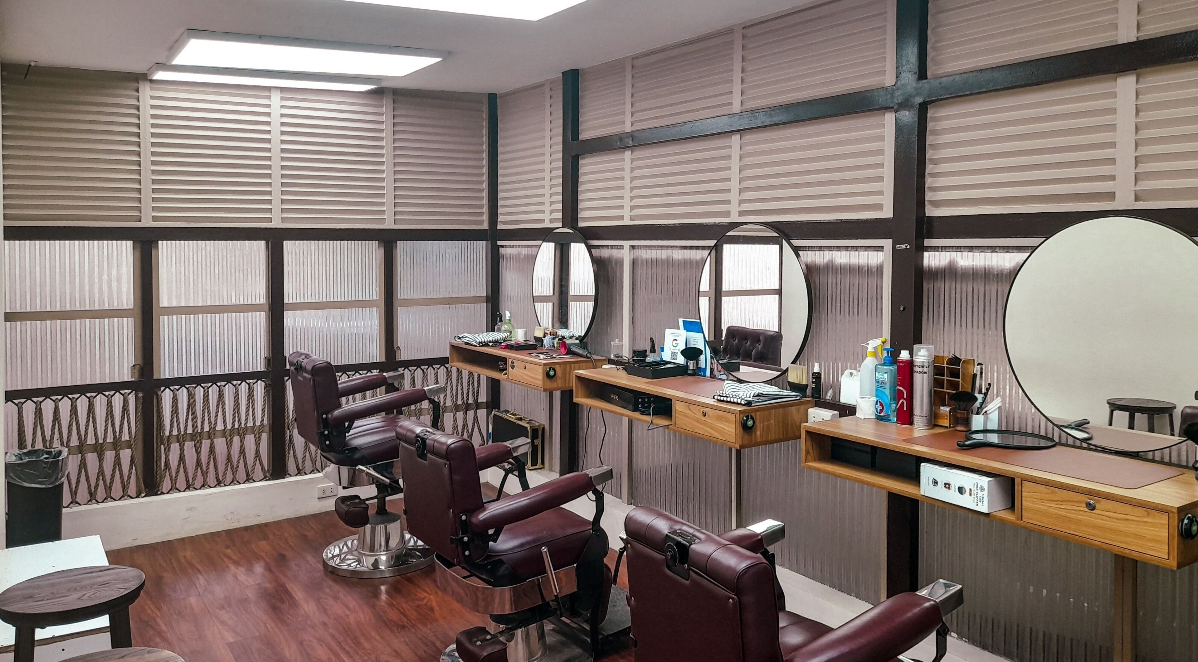 Elegant interior of Manong Barbers - Angono, Rizal in Angono, Calabarzon, PH showcasing vintage barber chairs.