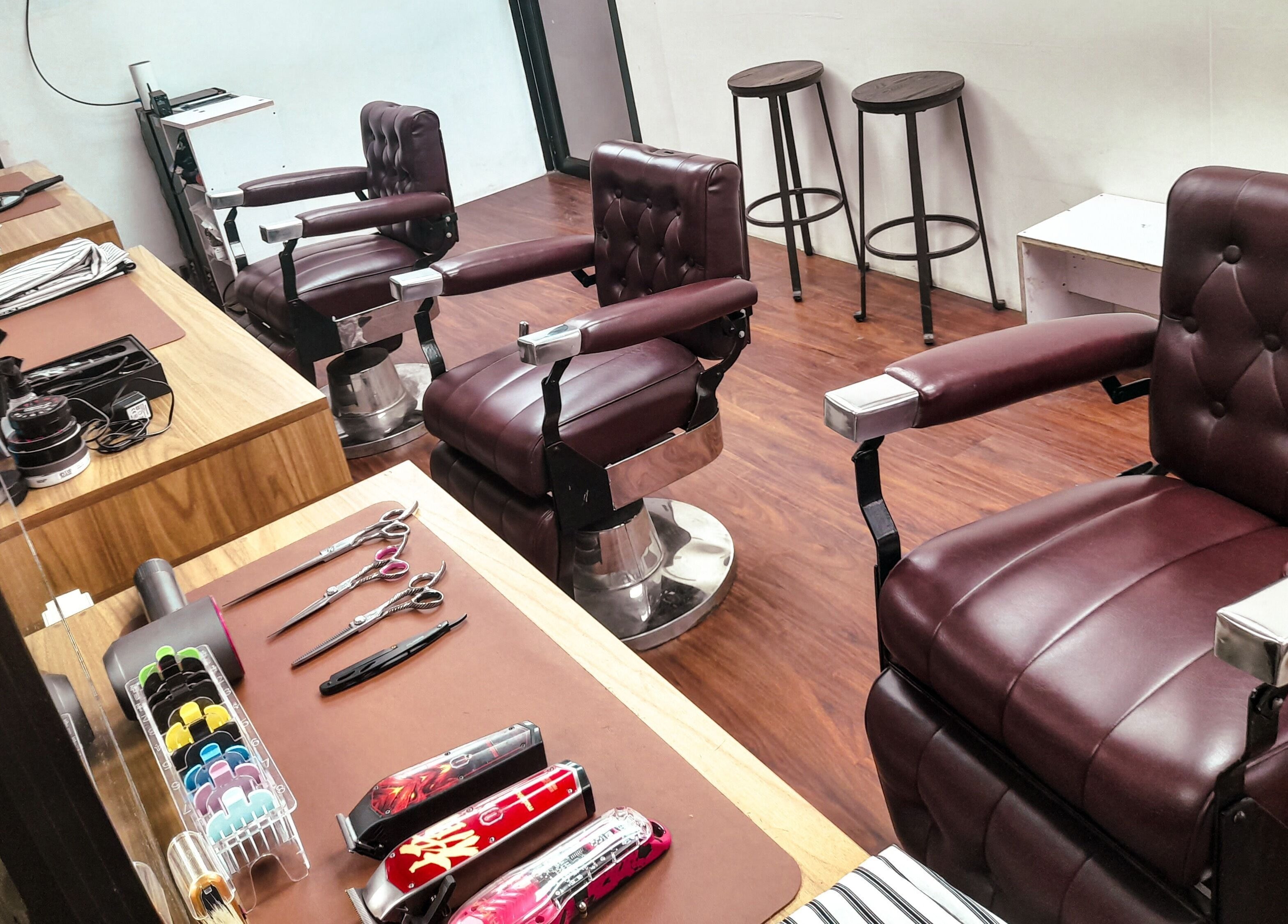 Stylish barber chairs at Manong Barbers - Angono, Rizal, Angono, Calabarzon, PH, showcasing a modern, sleek interior.