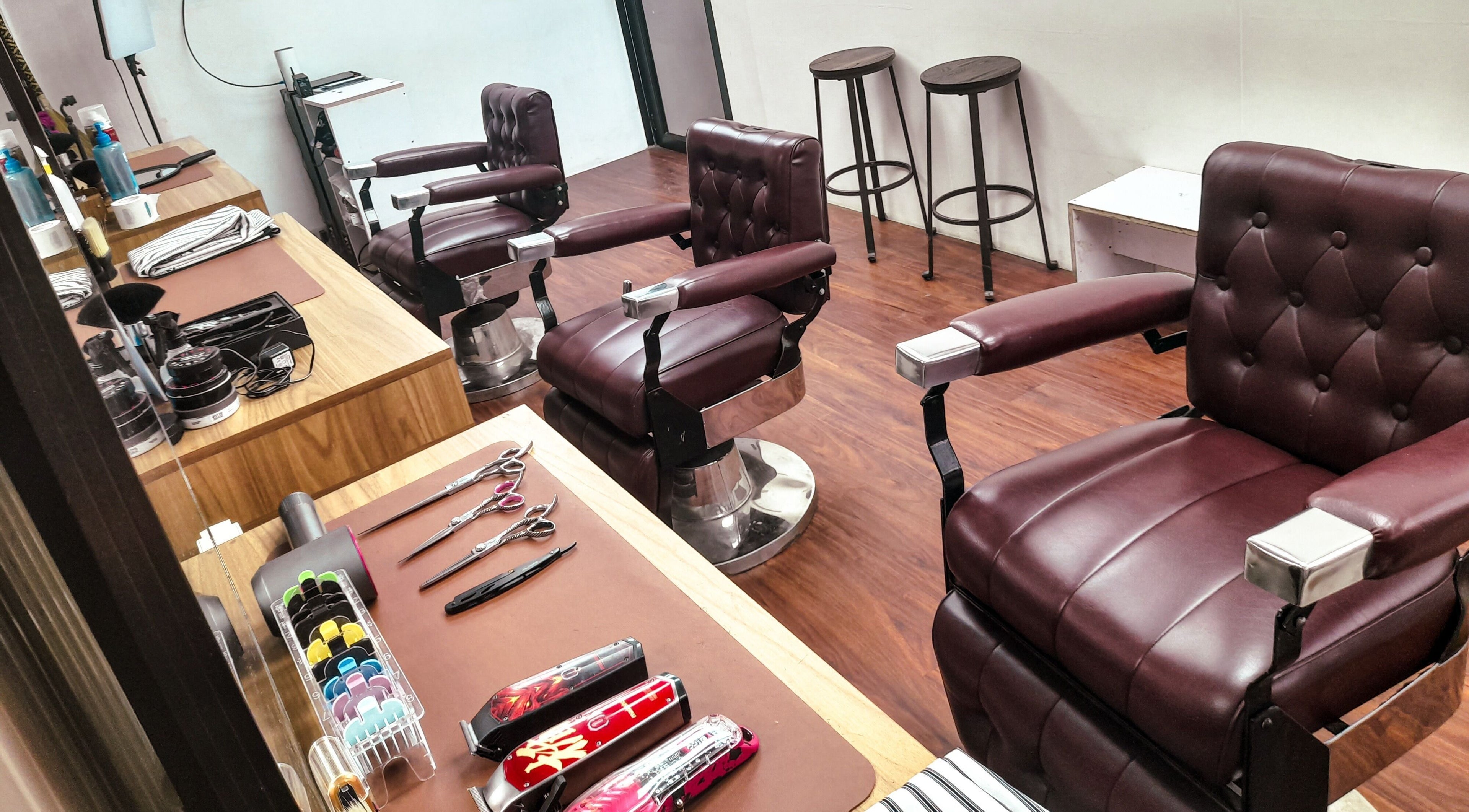 Stylish barber chairs at Manong Barbers - Angono, Rizal, Angono, Calabarzon, PH, showcasing a modern, sleek interior.