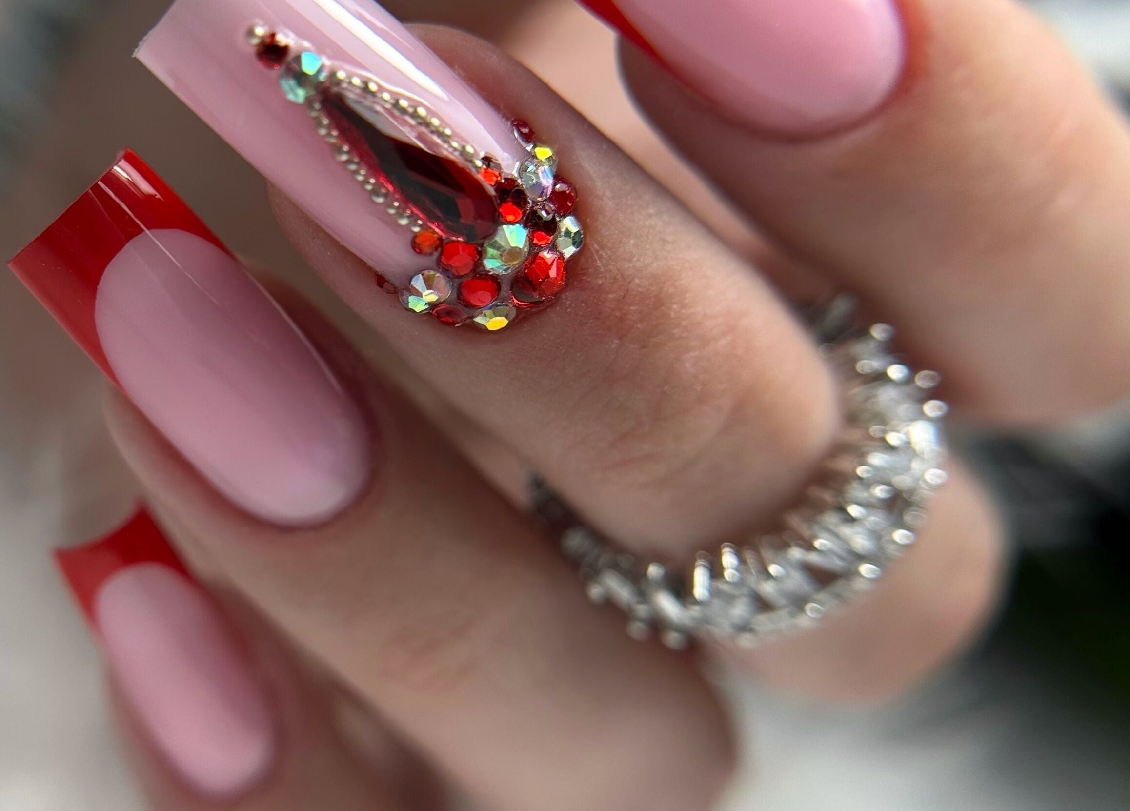 Elegant nail art with red jewels at Daniela Siantova Nail Courses, Hull, England, GB