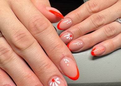 Floral nail art by Kate Brooks ~ Nail Artist in Llandudno, Wales, GB showcasing red accents and white designs.
