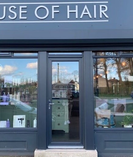 Front view of Mbhairdressing at Forest Hall, Newcastle Upon Tyne, England, GB showcasing modern glass facade.
