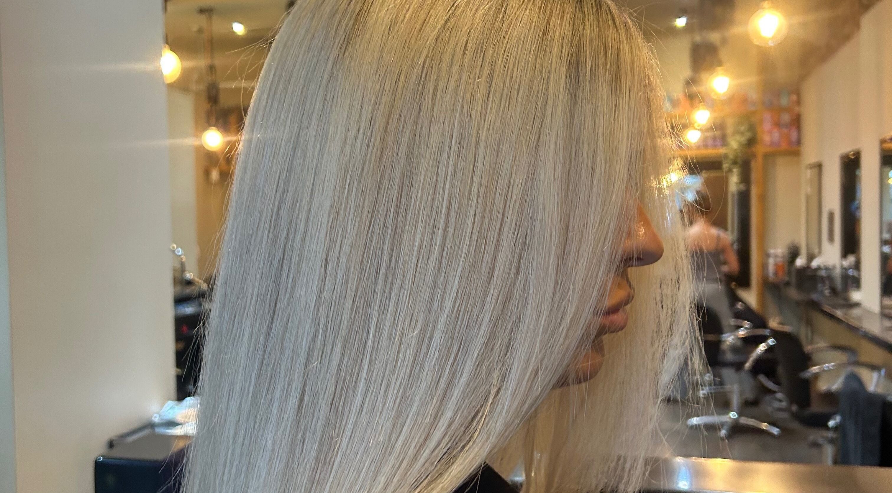 Elegant blonde hairstyle at Mbhairdressing, Forest Hall, Newcastle Upon Tyne, England, GB salon.