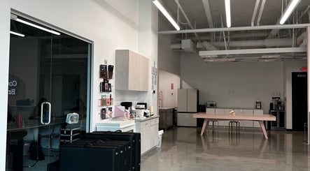 Modern interior of Inked by Kings, Salt Lake City, Utah, US, showcasing a sleek workspace with minimalist design.