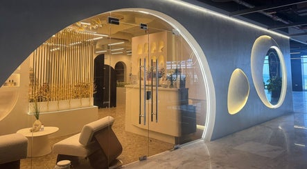 Elegant entryway of Ora Touch in Al Khobar, Eastern Province, SA featuring modern decor and glass doors.