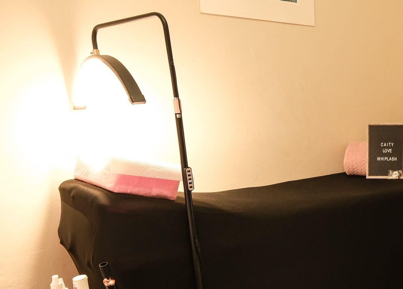 Comfortable massage bed at Whiplash, East London, Eastern Cape, ZA, lit warmly for a relaxing ambiance.