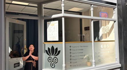 Entrance of Thaidy Massage in Newport, Wales, GB with a welcoming staff member.
