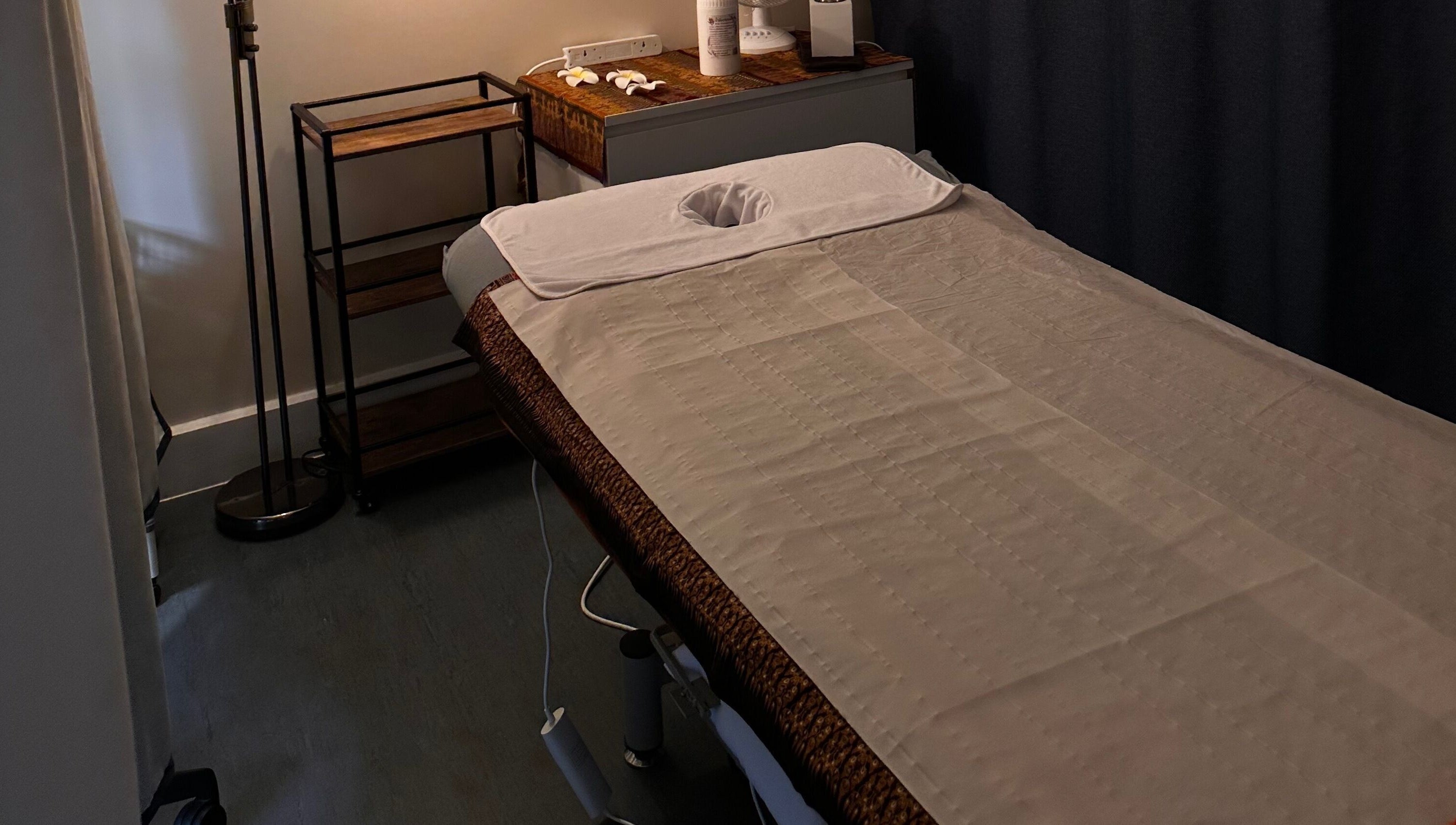 Tranquil therapy room at Thaidy Massage, Newport, Wales, GB, featuring a massage table and calming decor.