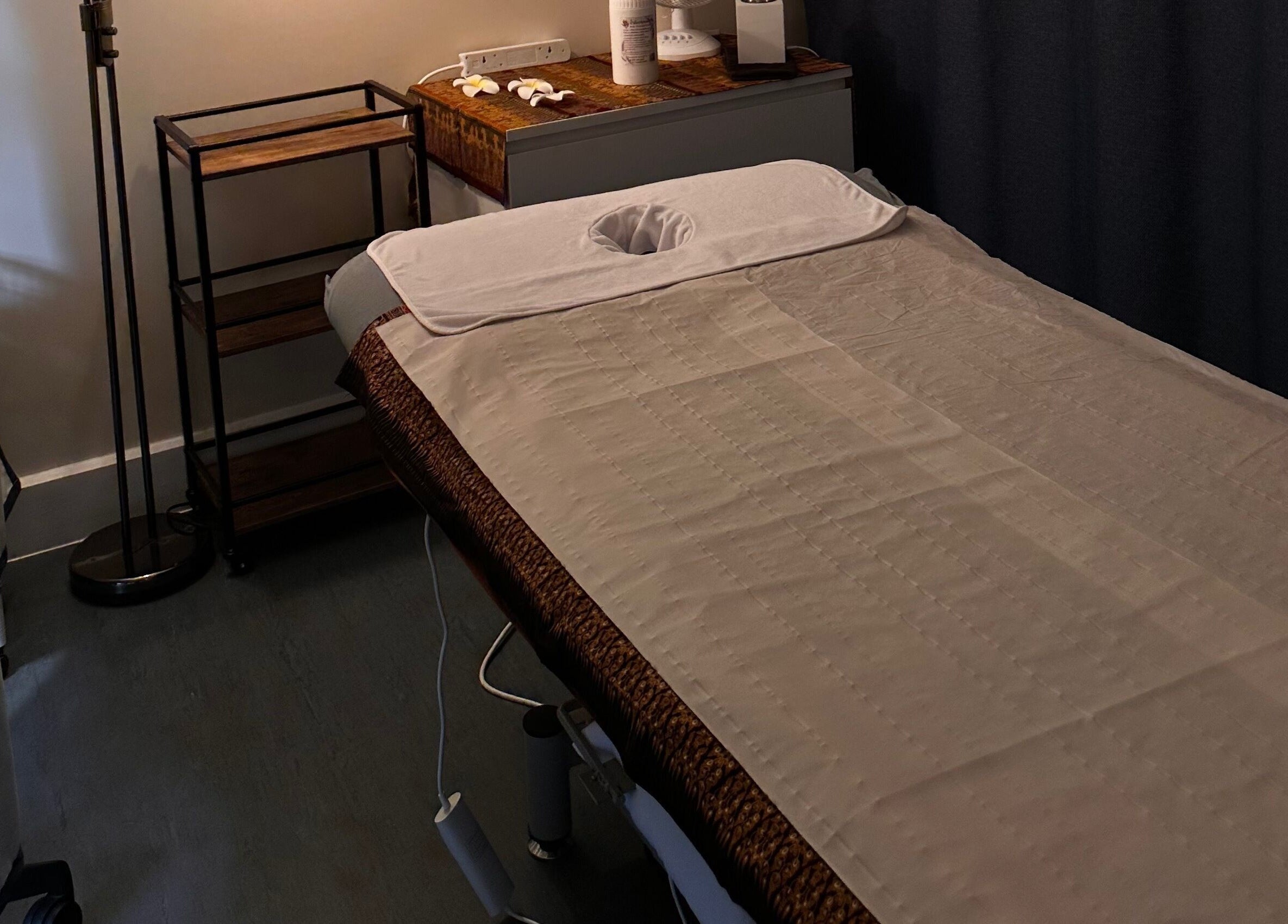 Tranquil therapy room at Thaidy Massage, Newport, Wales, GB, featuring a massage table and calming decor.
