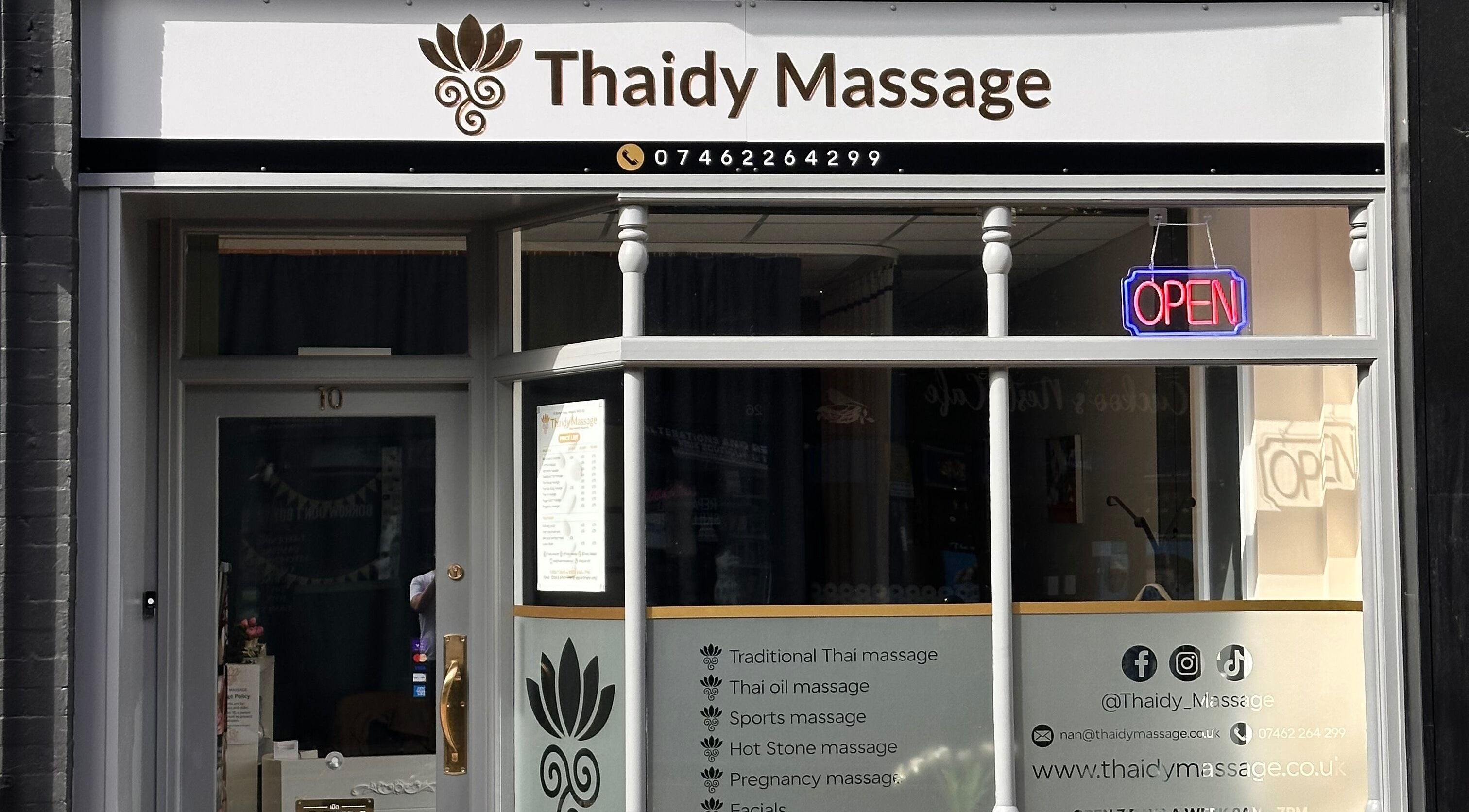 Thaidy Massage entrance in Newport, Wales, GB with a bright open sign and service listings.