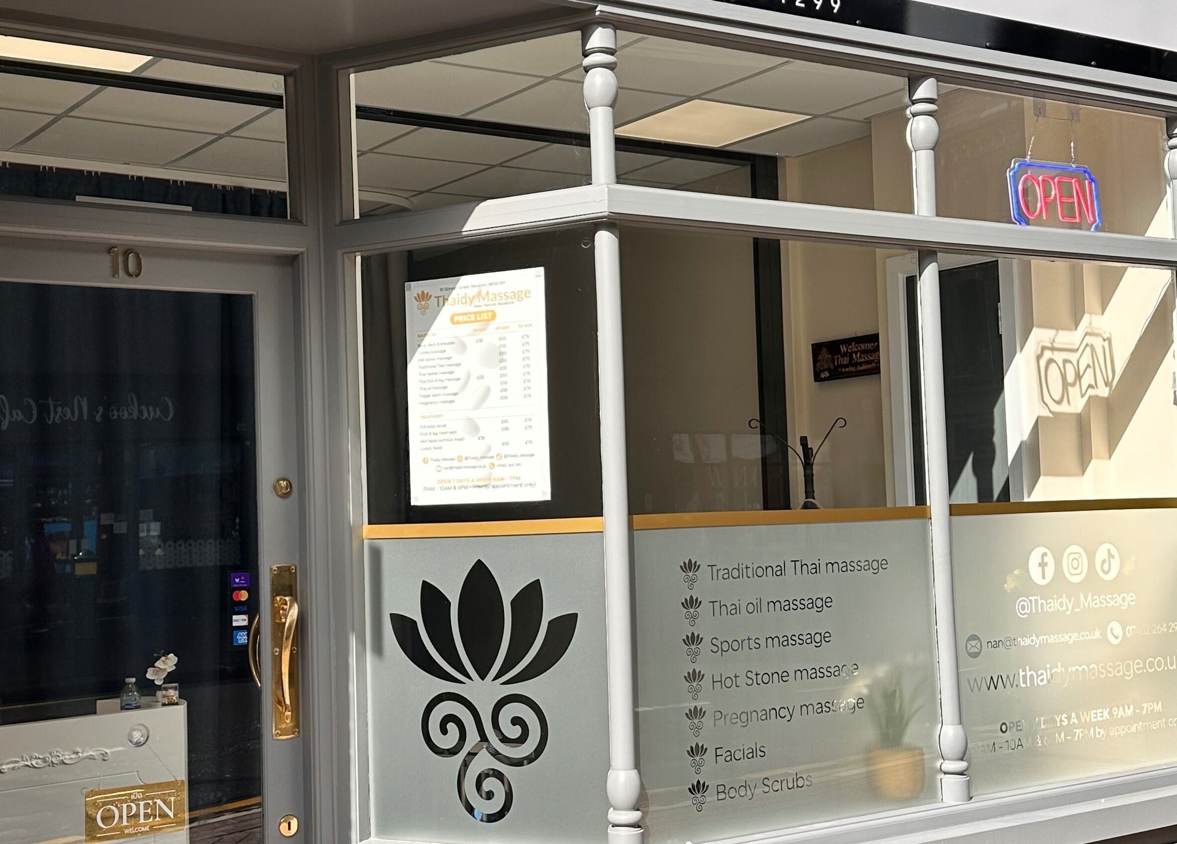 Thaidy Massage exterior in Newport, Wales, GB, showcasing services on frosted glass.