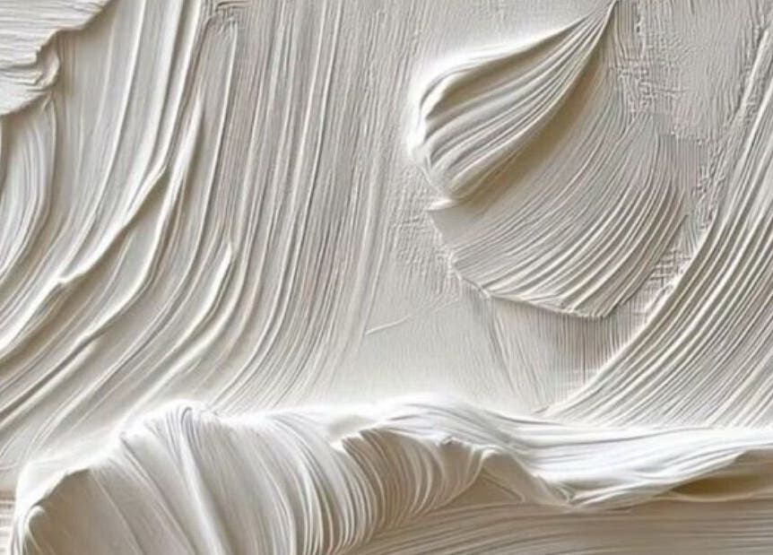 Close-up of textured wall at Classic Touch, Noord, AW, showcasing detailed elegance and artistry.