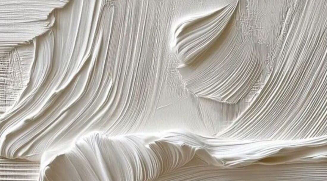 Close-up of textured wall at Classic Touch, Noord, AW, showcasing detailed elegance and artistry.