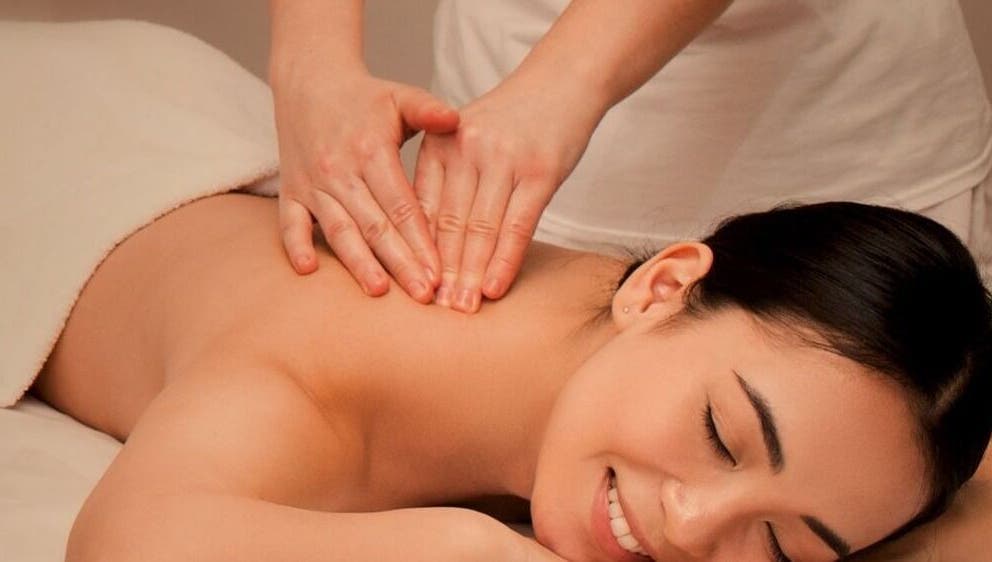A soothing massage at Perfect Day SPA in Pasadena, California, US, featuring a woman enjoying relaxation.