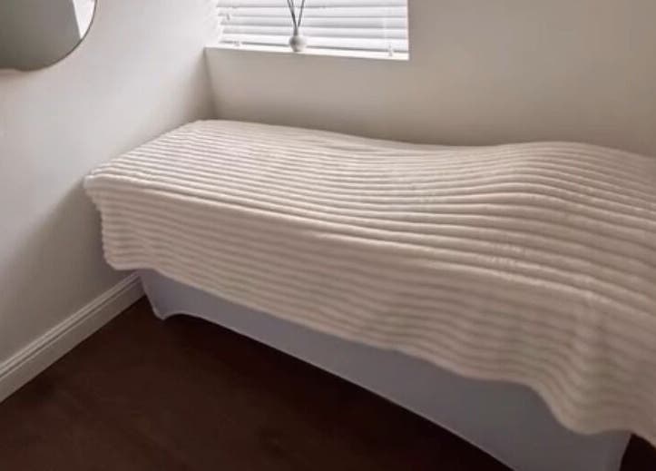 Tranquil treatment bed in Halo Skin Lab, Worsley, England, GB, perfect for relaxation and beauty therapies.