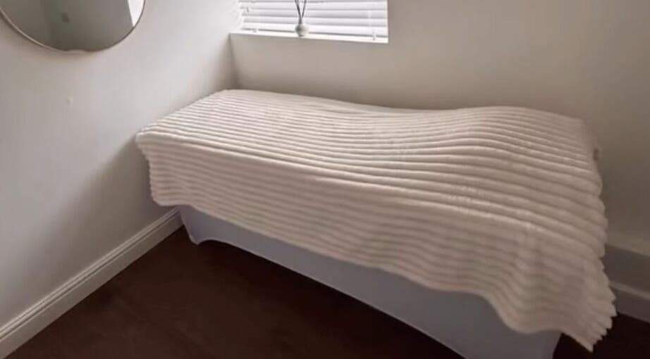 Tranquil treatment bed in Halo Skin Lab, Worsley, England, GB, perfect for relaxation and beauty therapies.