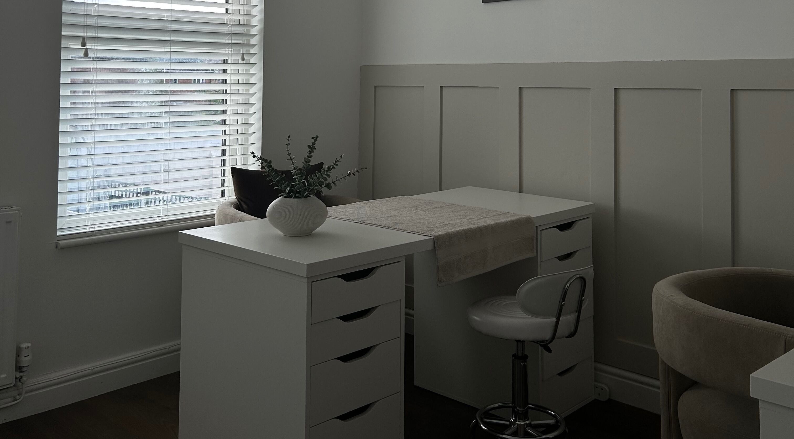 Halo Skin Lab's elegant treatment space in Worsley, England, features modern decor and calming ambiance.