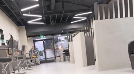 Modern interior of Marko Beauty Salon in Glendale, California, US, showcasing sleek styling stations.