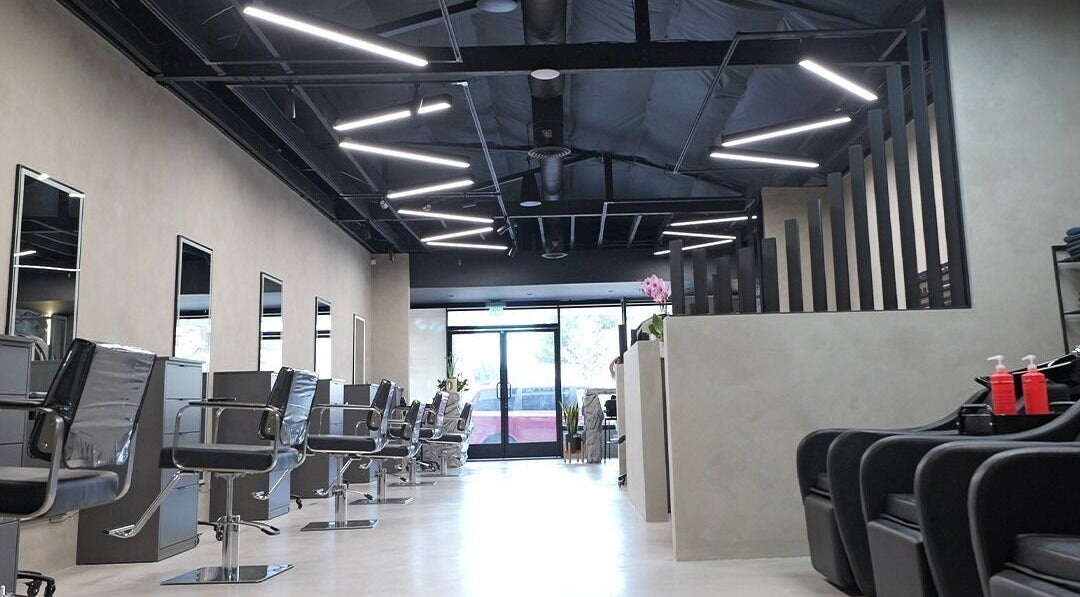 Modern interior of Marko Beauty Salon in Glendale, California, US with stylish black chairs and sleek design.