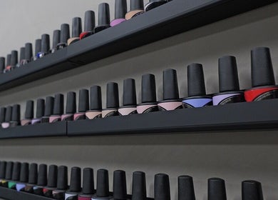 Rows of vibrant nail polishes on display at Marko Beauty Salon, Glendale, California, US.